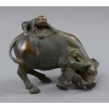 A bronze model of a bull and boys. 16.5 cm long.