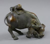 A bronze model of a bull and boys. 16.5 cm long.