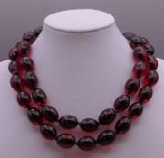 A bead necklace. Approximately 80 cm long.