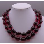 A bead necklace. Approximately 80 cm long.