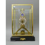 A moonphase skeleton clock. 51.5 cm high overall.