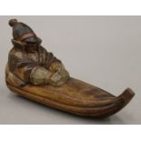 A Swedish Folk Art carving of a sledge by M Lenius. 24 cm long.