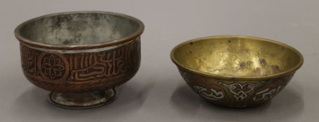 A tinned copper bowl with Arabic inscriptions and a Cairo Ware bowl with silver and copper