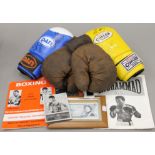 A collection of signed boxing memorabilia, including a £5 note signed by Henry Copper,