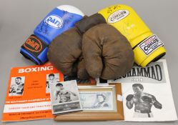 A collection of signed boxing memorabilia, including a £5 note signed by Henry Copper,