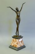 An Art Deco style bronze model of a dancer. 56 cm high.