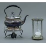 A plated kettle on stand and an egg timer. The former 31 cm high.