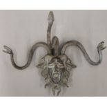 A bronze wall mount formed as Medusa. 36.5 cm wide.