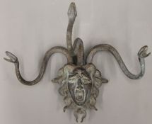 A bronze wall mount formed as Medusa. 36.5 cm wide.