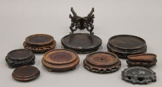 A collection of Chinese wooden stands.