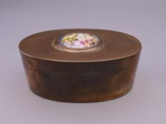 A 19th century oval copper box with hinged lid,