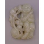 A pierced jade carving of a boy. 6 cm high.