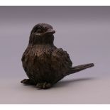 A bronze model of a bird. 4 cm high.