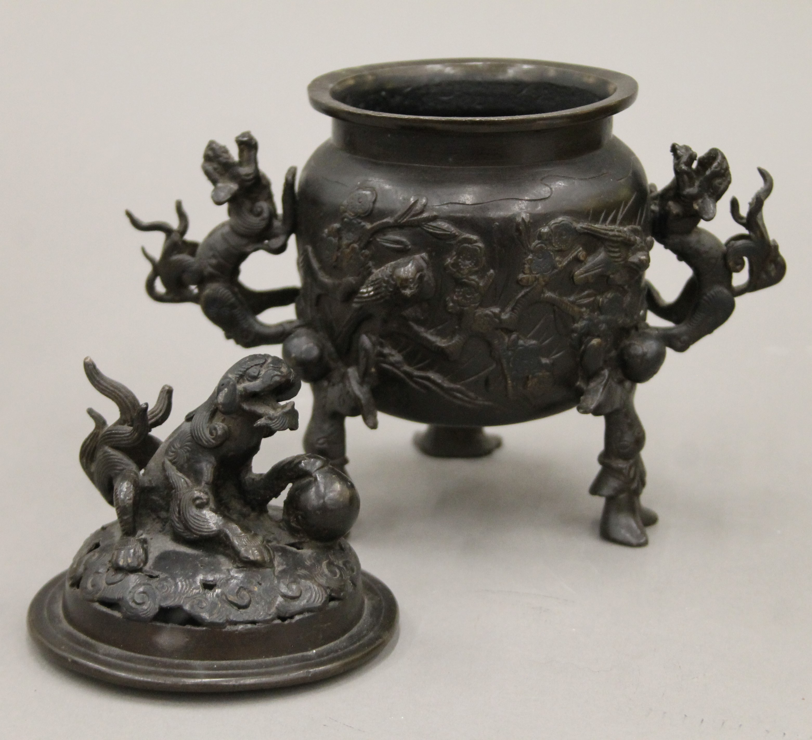 A Japanese patinated bronze tripod incense burner with dragon handles and pierced lid. 20 cm high. - Image 5 of 5