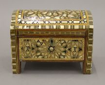 An Eastern mother-of-pearl inlaid dome top box. 21.5 cm wide.