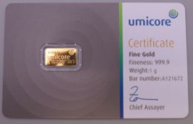 A Umicore 1 gram fine gold bar.
