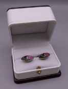 A pair of Hackett of London rugby ball cufflinks. 2 cm wide.