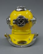 A small model of a diver's helmet. 17 cm high.