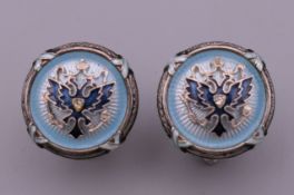 A pair of silver and blue enamel cufflinks. 1.5 cm diameter.