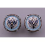 A pair of silver and blue enamel cufflinks. 1.5 cm diameter.