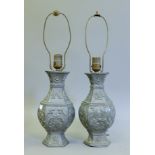 A pair of Chinese pewter lamps. 51 cm high overall.