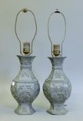 A pair of Chinese pewter lamps. 51 cm high overall.