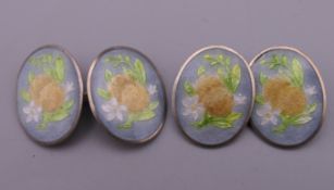 A pair of silver enamel cufflinks. 1.5 cm high.