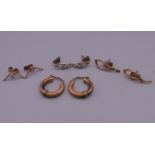 Four pairs of 9 ct gold earrings.
