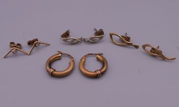 Four pairs of 9 ct gold earrings.