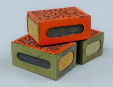 Three cinnabar matchbox holders. Each 6 cm long.