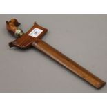 A Sumatran kris dagger with carved hardwood handle and sheath. 30.5 cm long.