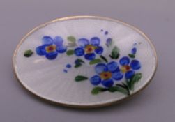 A David Anderson enamel oval flower brooch. 2.5 cm wide.