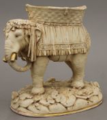 An Austrian porcelain centrepiece formed as an elephant. 22 cm high.