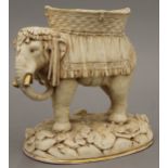 An Austrian porcelain centrepiece formed as an elephant. 22 cm high.