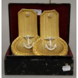 A cased pair of Royal Naval epaulettes.