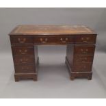 A pedestal desk. 121 cm wide.