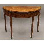 A Georgian satinwood crossbanded sabicu demi lune tea table. 98 cm wide.