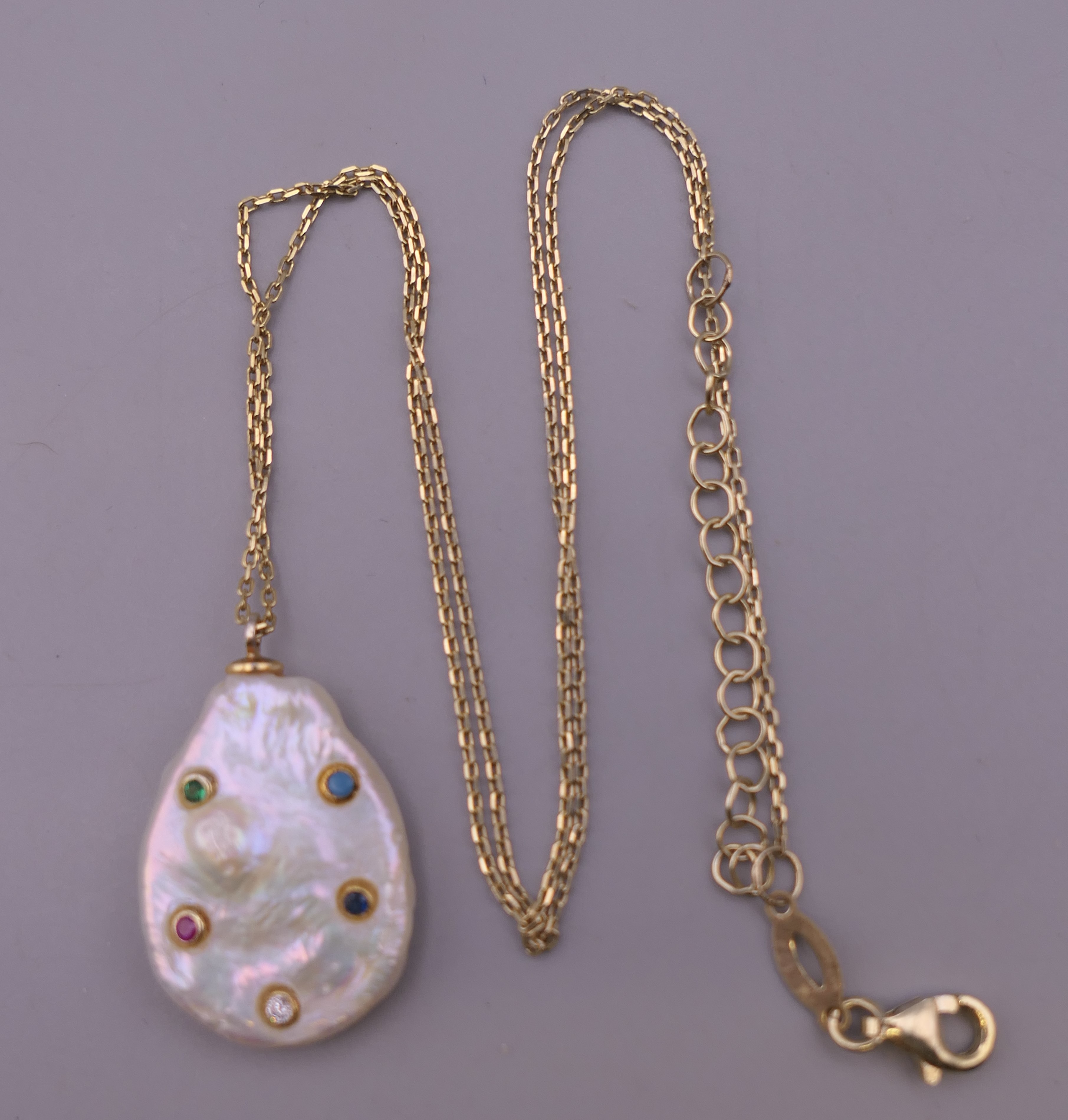 A stone set mother-of-pearl pendant mounted on a silver gilt chain. The pendant 2.5 cm high. - Image 4 of 6