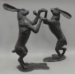 A pair of large bronze boxing hares. The largest 83 cm high.