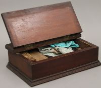 A mahogany shoe shine box. 40 cm wide.