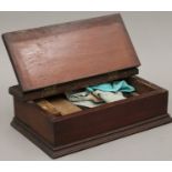 A mahogany shoe shine box. 40 cm wide.