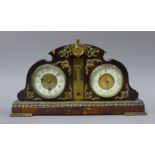 A tortoiseshell clock and barometer. 38 cm wide.