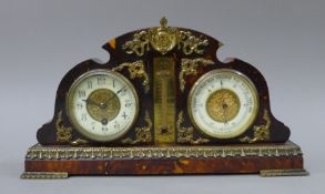 A tortoiseshell clock and barometer. 38 cm wide.