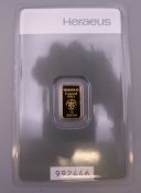 A Heraeus 1 gram fine gold bar.