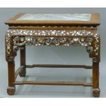 A 19th century Chinese mother-of-pearl inlaid marble topped low table (adapted from a chair). 62.