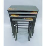 A nest of four chinoiserie lacquered tables. 66.5 cm wide, 71 cm high, 36 cm deep.