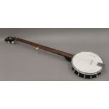 A post-war British John Grey long neck five string bluegrass banjo in a hard case bearing the grey