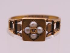 A 15 ct gold and seed pearl ring. Ring size N/O. 2.1 grammes total weight.