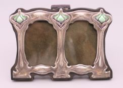 An Art Nouveau style sterling silver double photograph frame. 8 cm x 11 cm.