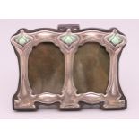 An Art Nouveau style sterling silver double photograph frame. 8 cm x 11 cm.